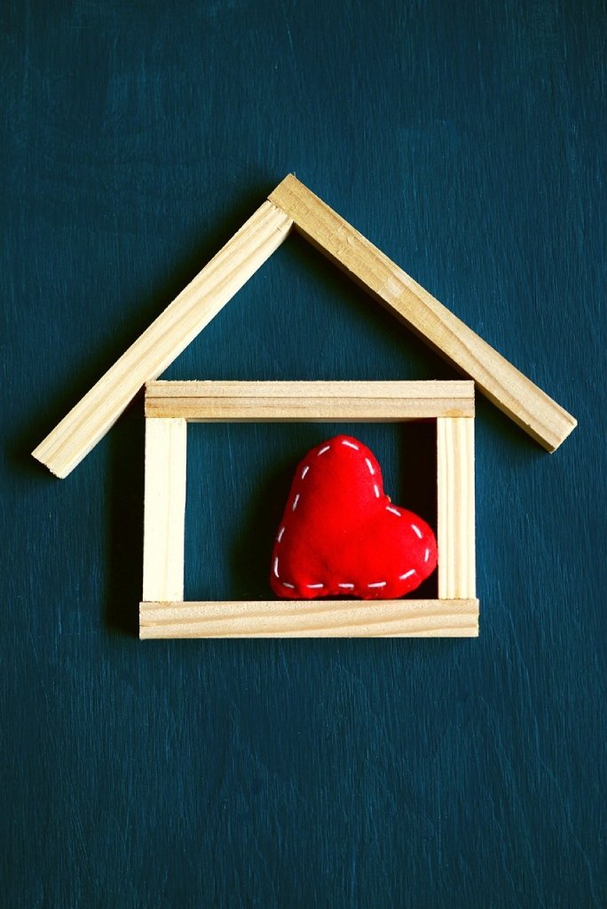 Small wooden sticks shaped like a house with a heart inside
